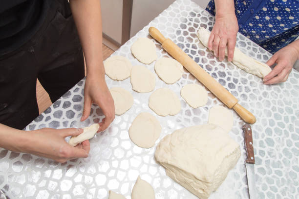 istock cooking cakes of the dough in the kitchen 909752200