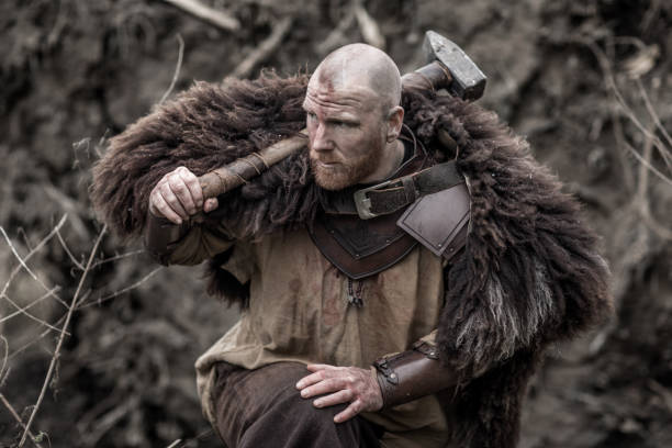 istock Hammer wielding bloody viking warrior alone in a winter forest 909752802
