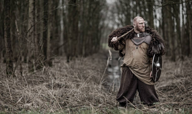 istock Hammer wielding bloody viking warrior alone in a winter forest 909752908
