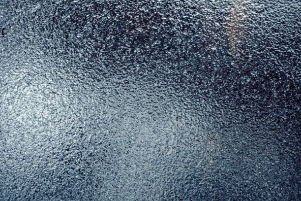 istock Background of a window covered with ice, due to freezing rain. 909756590