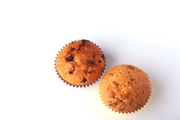 istock Tasty chocolate cupcakes, muffins on a white wooden table 909762076