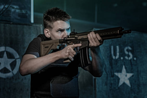 istock Krav Maga fighting team member during training in dark indoor urban setting 909765812
