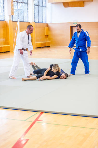 istock Young Adult Women Learning  the Selfdefence Techniques 909768850