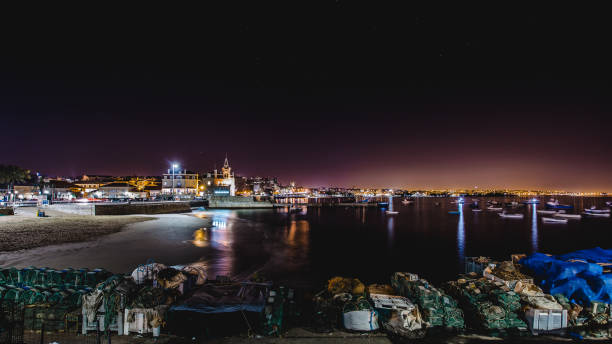 istock cascais ocean promenade night 909771786