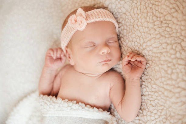 istock beautiful newborn sleep in crib 909772004