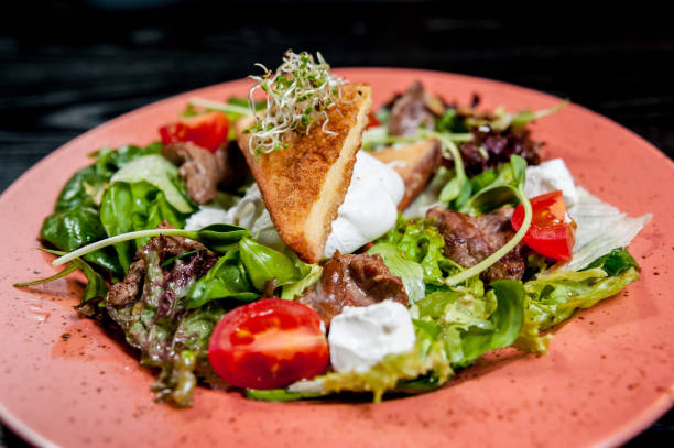 istock Salad with meat and vegetables 909772580