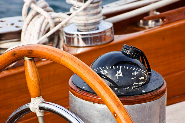 руль направления и компас - nautical vessel outdoors color image nautical equipment стоковые фото и изображения