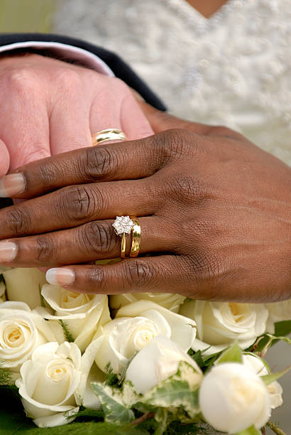 istock Wedding rings on hands of bride and groom 90978271