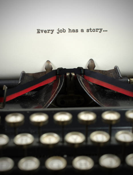 istock Close-up antique typewriter with job story 909785816