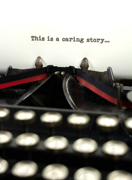 istock Close-up antique typewriter with words caring story 909785960
