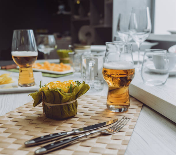 Beer and chips on the large white table