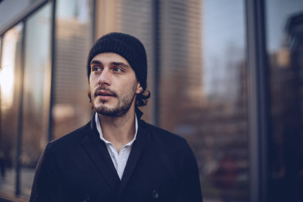 istock Young man standing outdoors 909791638