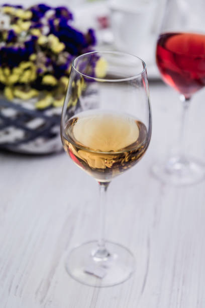 istock White wine in a glass. 909795338