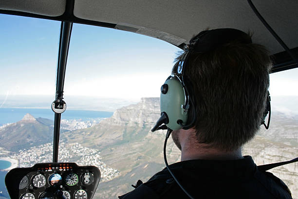 istock View from inside of a helicopter flying over an island 90980016