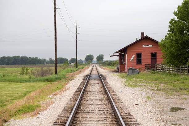 IOWA CITY, IOWA - MAY 20, 2017: The old train station in Amana, Iowa. The Amana Colonies were originally settled by German settlers and are now a tourist attraction and National Historic Landmark.