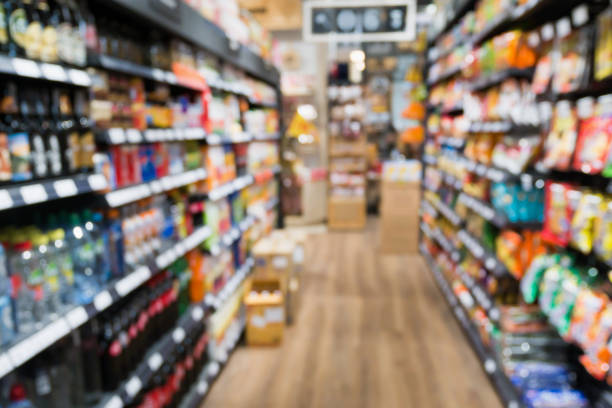 istock Abstract Supermarket aisle blur background 909805746