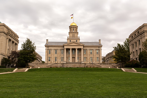 IOWA CITY, IOWA - OCTOBER 29, 2017: The western elevation of the old state capitol building, now part of the University of Iowa, on an autumn evening. Iowa City is the only UNESCO-designated City of Literature in the US.