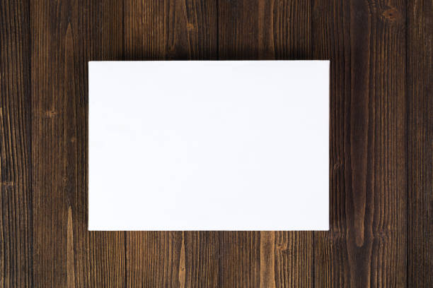 istock Empty white gift box or tray for mock up on dark wooden table with copy space. 909806058