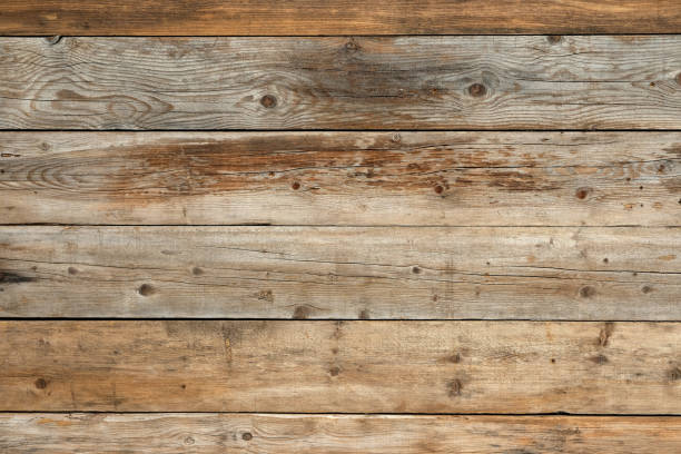 istock Old faded pine natural wood background 909809982