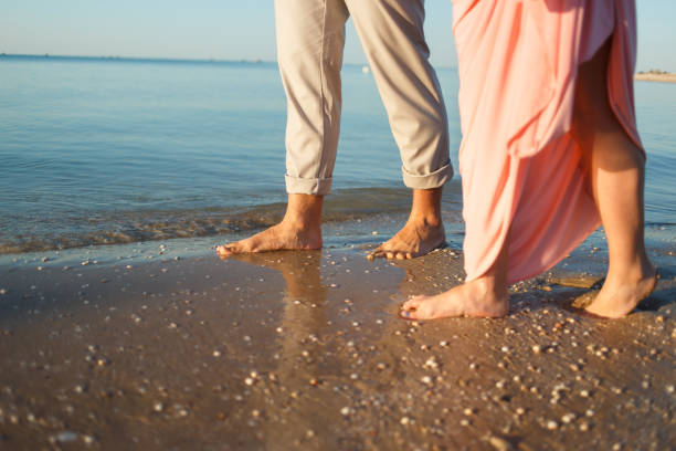 istock couple on the beach 909816694