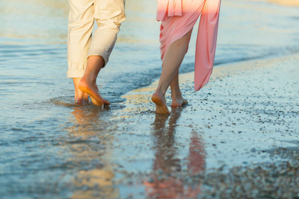 istock couple on the beach 909816826