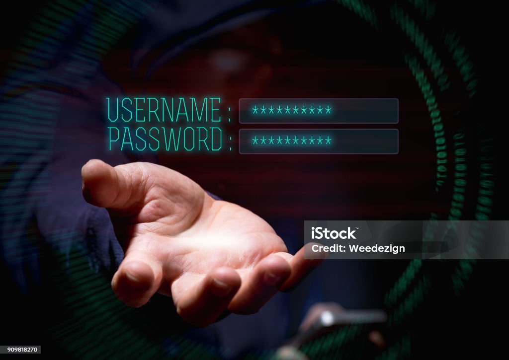 Hooded cyber crime hacker using mobile phone and internet hacking in to cyberspace for username and password,online personal data security concept Hooded cyber crime hacker using mobile phone and internet hacking in to cyberspace for username and password,online personal data security concept. Stealing - Crime Stock Photo