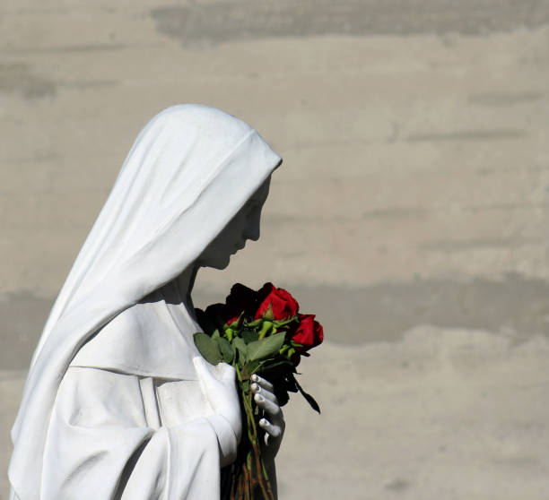 Virgin Mary holding roses