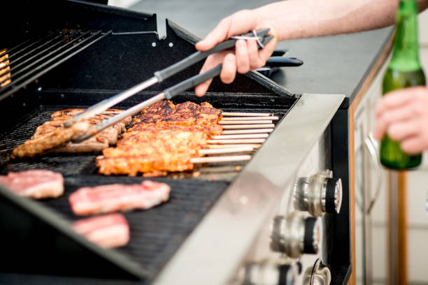 istock Roasting meat on the outdoor grill 909819116
