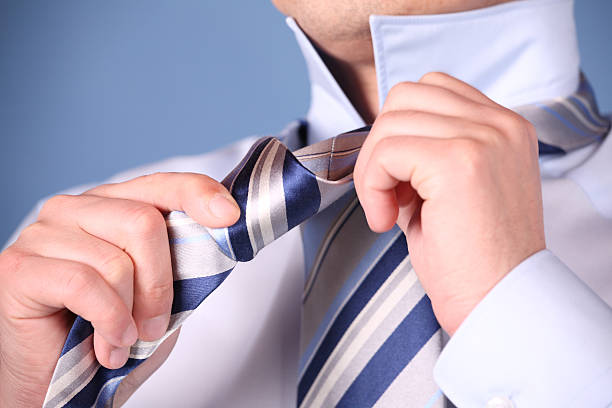 Tie a Necktie 2  necktie businessman collar tied knot stock pictures, royalty-free photos & images