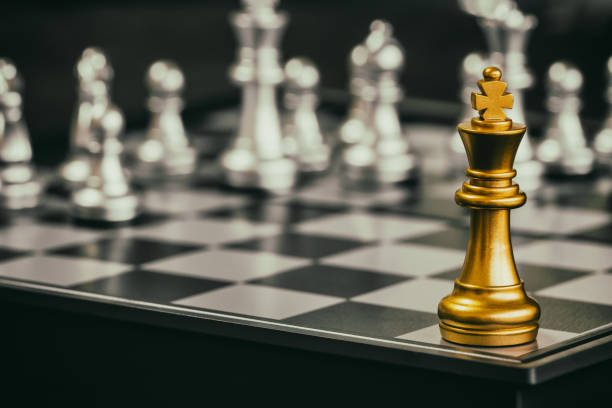 istock Strategy chess battle Intelligence challenge game on chessboard. Success the strategy concept. Chess business leader and success idea. Chess strategy game business competition success play. 909822288