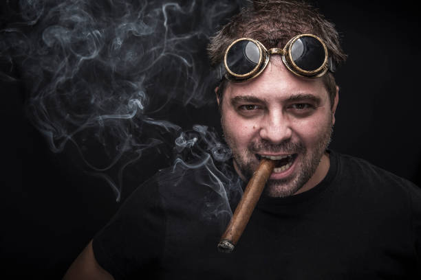 istock Steampunk smoker with a cuban cigar 909828432