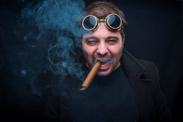 istock Steampunk smoker with a cuban cigar 909828678