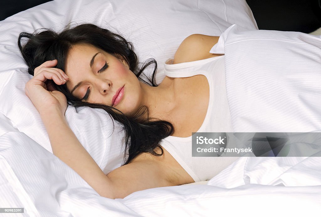 Young brunette woman sleeping in all white bed /file_thumbview_approve.php?size=2&id=5489263 Adult Stock Photo