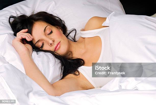 Young Brunette Woman Sleeping In All White Bed Stock Photo - Download Image Now - Adult, Adults Only, Beautiful People