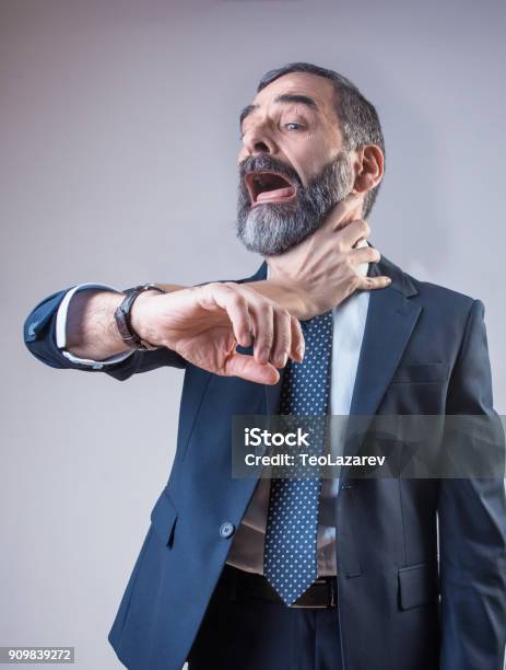 Wristwatch Choking A Senior Business Man Stock Photo - Download Image Now - Choking, Neck, Strangling