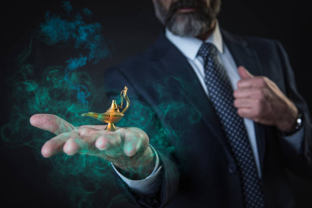 Business wishes coming true Wish come true, senior businessman holding magic aladdin's lamp, fumes coming out of it magic lamp photos stock pictures, royalty-free photos & images