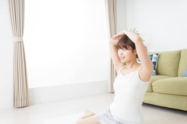 istock Woman doing some stretches in room 909843556