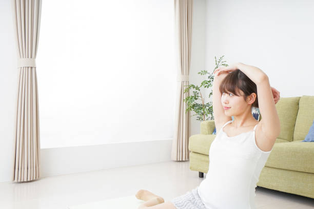 istock Woman doing some stretches in room 909843558