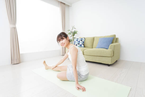 istock Woman doing some stretches in room 909843566