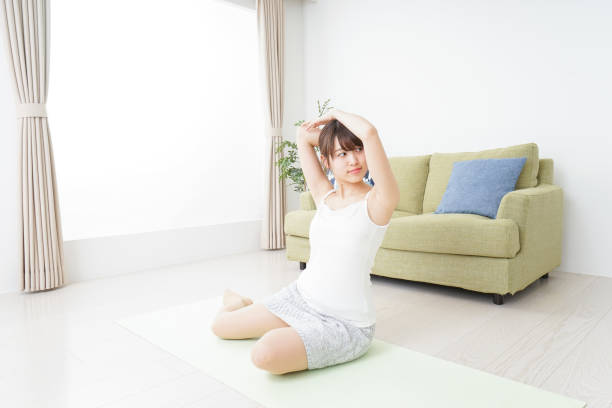 istock Woman doing some stretches in room 909843572