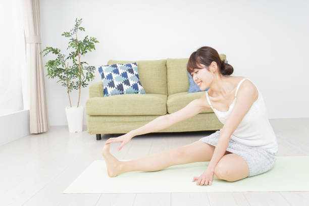 istock Woman doing some stretches in room 909843576