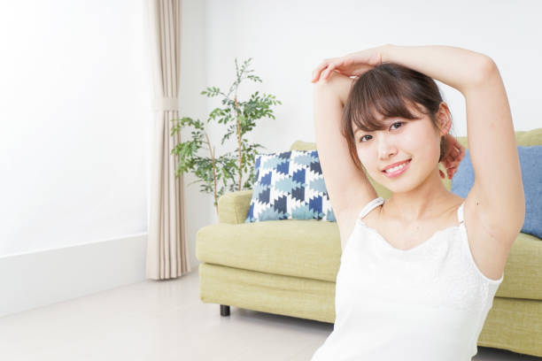 istock Woman doing some stretches in room 909843578