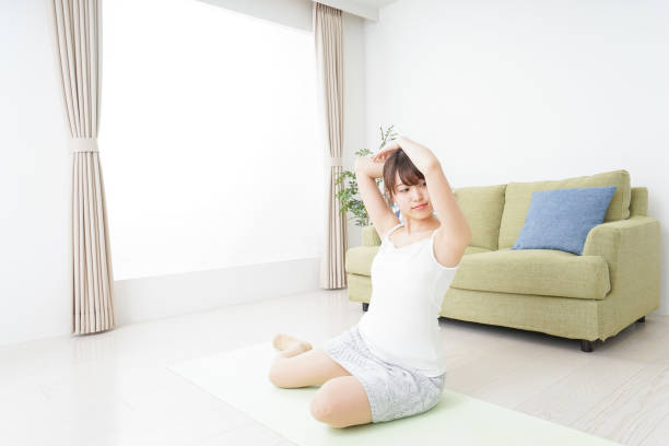 istock Woman doing some stretches in room 909843580