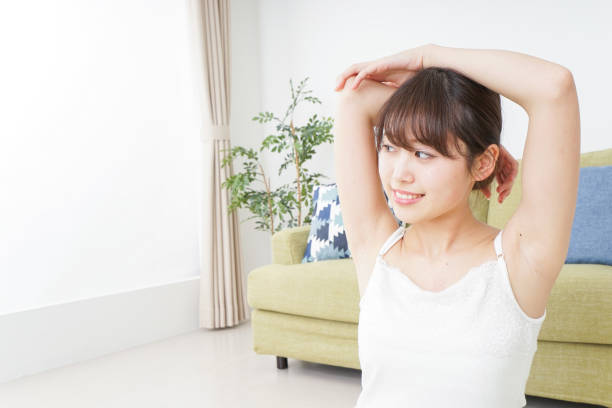 istock Woman doing some stretches in room 909843598
