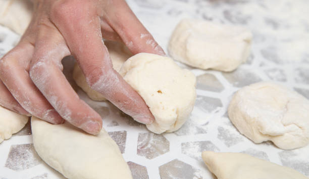 istock cooking cakes of the dough in the kitchen 909843768