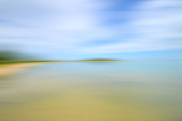 istock Motion blurred background of sky and the sea 909843802