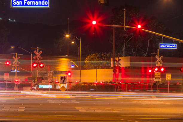 istock Railroad crossing during the night with motion gates 909844106