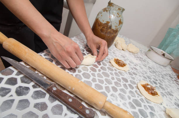 istock cooking cakes of the dough in the kitchen 909844258