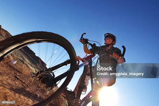 Smiling Mountain Biking Woman And Sunshine Stock Photo - Download Image Now - Adult, Adults Only, Adventure