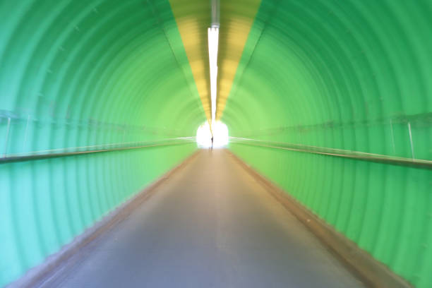 istock deep of green color tunnel horror feel 909846432